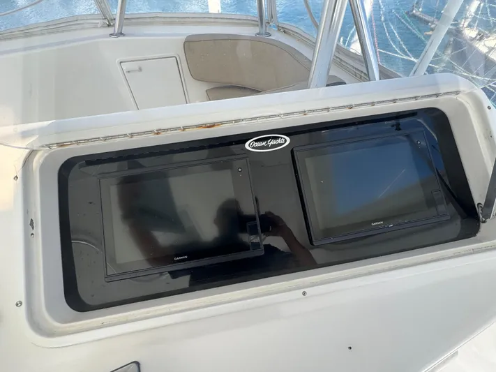 Nana Yacht Photos Pics Control panel of 2000 Ocean Yachts 48 Convertible with dual screens.
