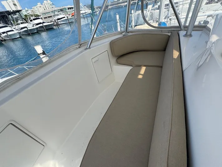 Nana Yacht Photos Pics 2000 Ocean Yachts 48 Convertible boat interior with beige seating at marina.