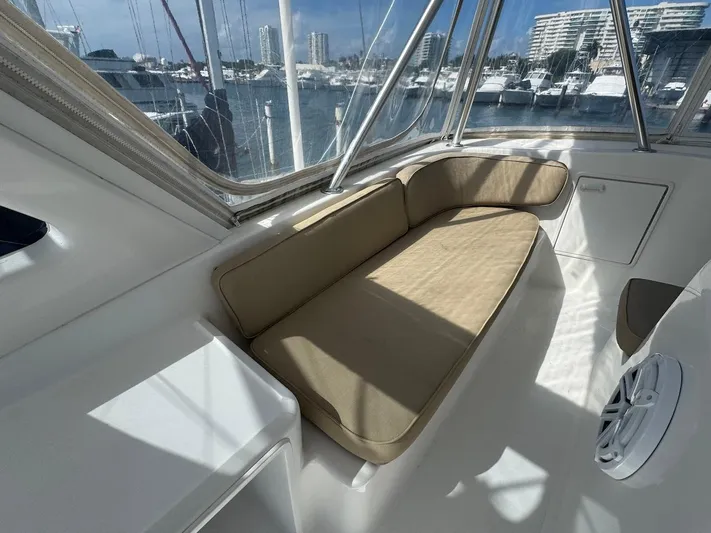 Nana Yacht Photos Pics Interior seating area of 2000 Ocean Yachts 48 Convertible, with marina view.