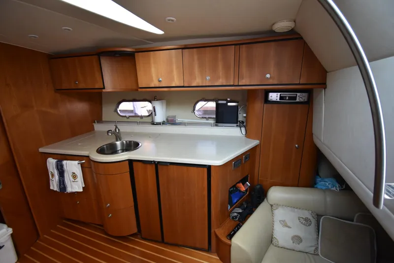  Yacht Photos Pics 2008 Tiara Yachts 39 Sovran interior kitchen with wooden cabinets and modern amenities.