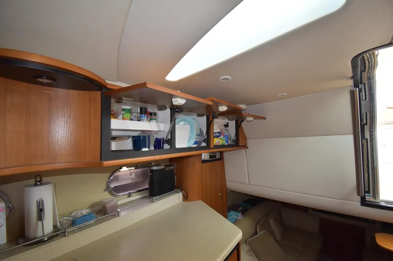  Yacht Photos Pics 2008 Tiara Yachts 39 Sovran interior with open cabinets and cozy seating area.