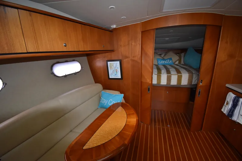  Yacht Photos Pics Interior of 2008 Tiara Yachts 39 Sovran, featuring cozy seating and elegant wood finishes.