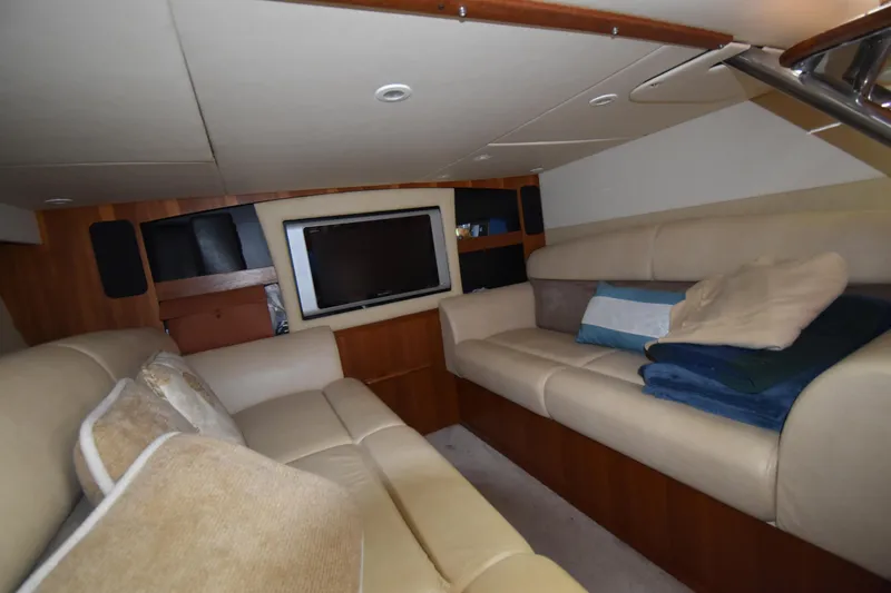  Yacht Photos Pics 2008 Tiara Yachts 39 Sovran interior with beige seating and a flat-screen TV.