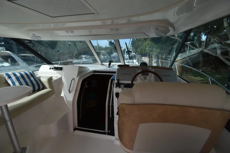  Yacht Photos Pics 2008 Tiara Yachts 39 Sovran interior with helm, seating, and large windows.