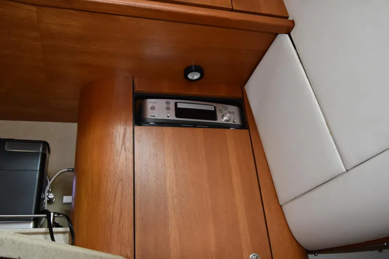  Yacht Photos Pics 2008 Tiara Yachts 39 Sovran interior with wooden cabinetry and built-in stereo system.