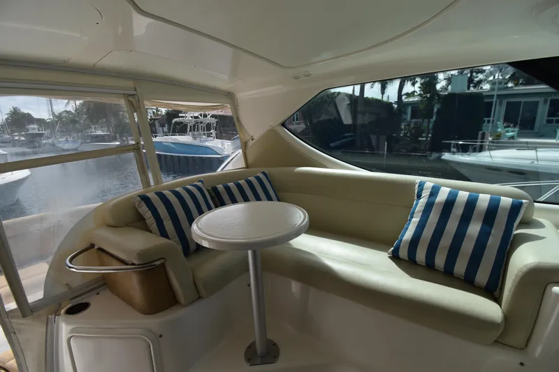  Yacht Photos Pics 2008 Tiara Yachts 39 Sovran interior with striped cushions and round table.