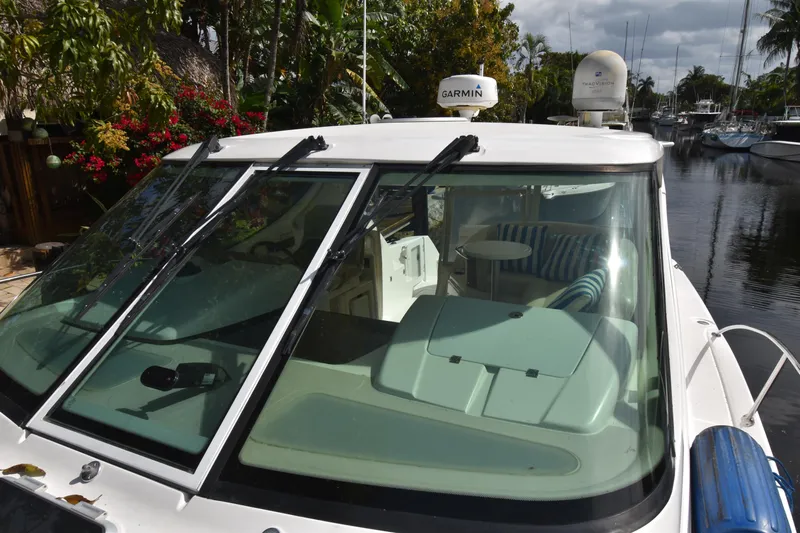  Yacht Photos Pics 2008 Tiara Yachts 39 Sovran with Garmin equipment, docked near lush greenery.