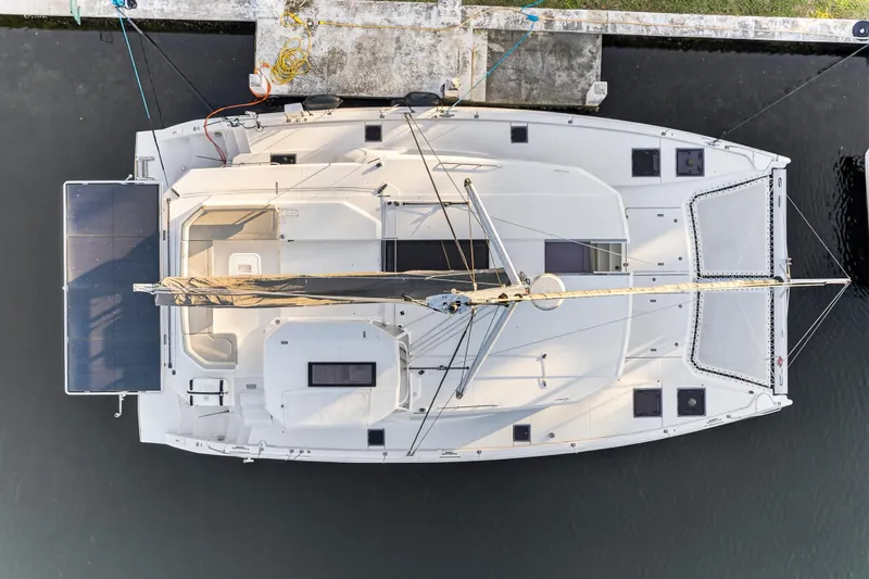  Yacht Photos Pics Overhead view of a 2022 Leopard 45 catamaran docked at a marina.