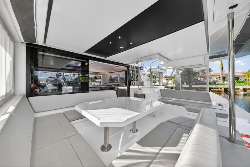  Yacht Photos Pics Luxurious 2022 Leopard 45 yacht interior with modern seating and sleek design.