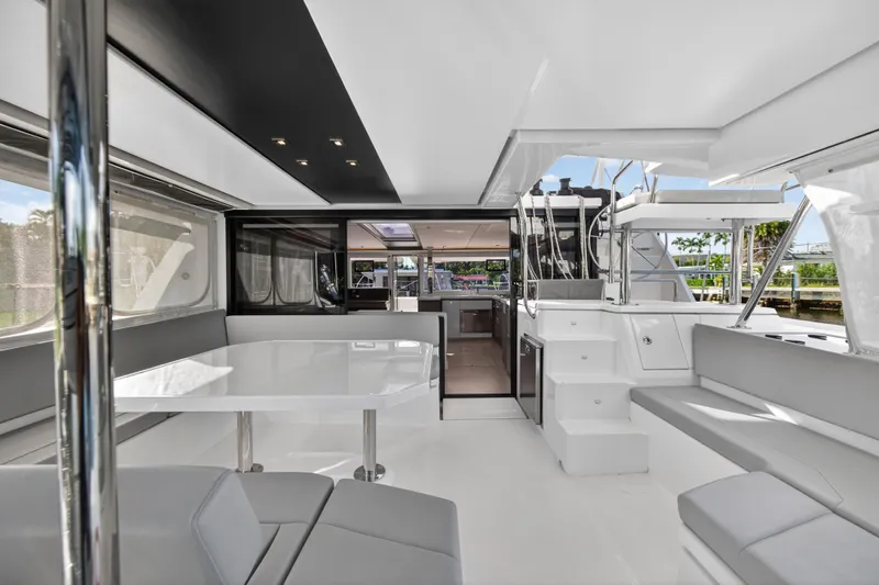  Yacht Photos Pics Luxurious interior of 2022 Leopard 45 catamaran with modern seating and dining area.