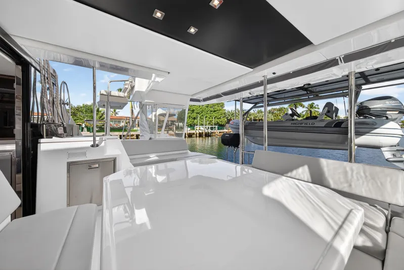  Yacht Photos Pics Luxurious 2022 Leopard 45 yacht interior with sleek seating and scenic water view.