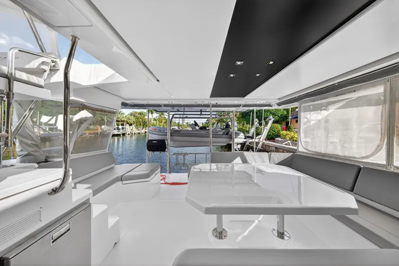  Yacht Photos Pics Luxurious interior of 2022 Leopard 45 catamaran with sleek design and spacious seating.