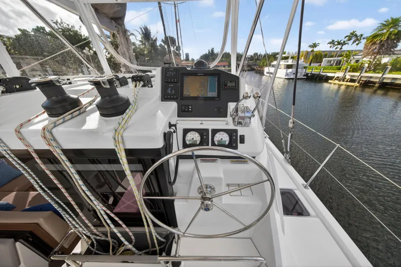 Yacht Photos Pics Helm of 2022 Leopard 45 catamaran with navigation instruments and steering wheel.