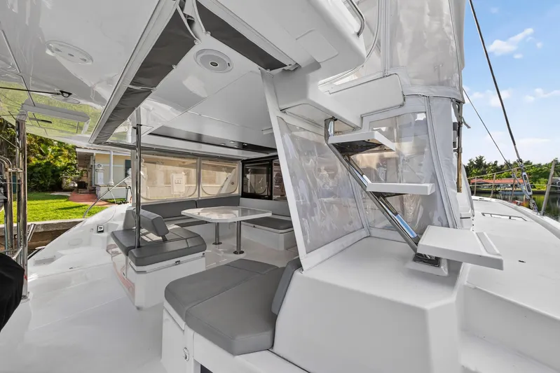  Yacht Photos Pics Spacious deck of 2022 Leopard 45 catamaran with modern seating and dining area.