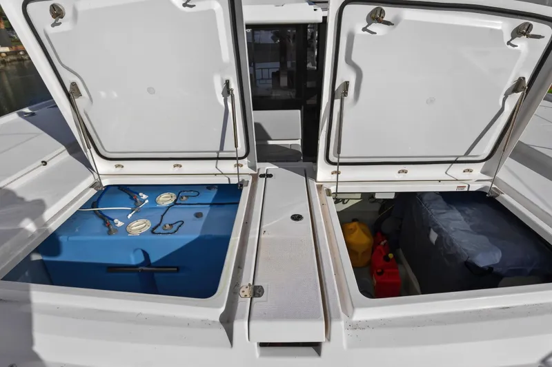  Yacht Photos Pics Open storage compartments on a 2022 Leopard 45 catamaran deck.