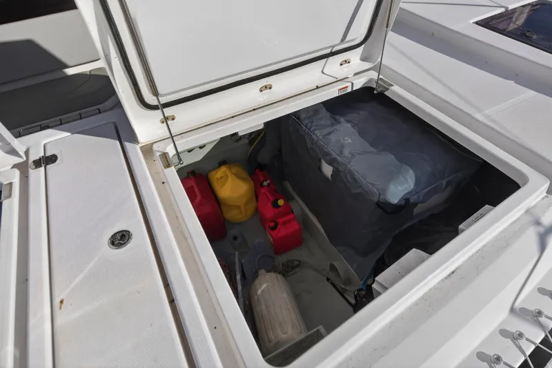  Yacht Photos Pics Open storage compartment on 2022 Leopard 45 yacht with fuel containers and equipment.