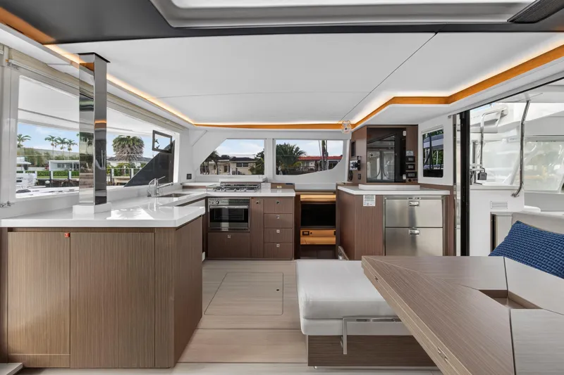  Yacht Photos Pics Luxurious interior of 2022 Leopard 45 yacht with modern kitchen and seating area.