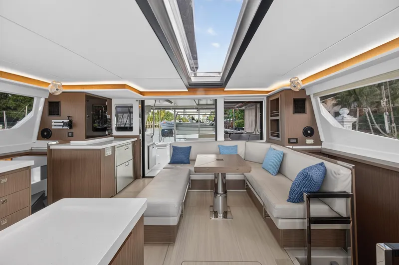  Yacht Photos Pics Luxurious interior of 2022 Leopard 45 catamaran with modern seating and elegant design.