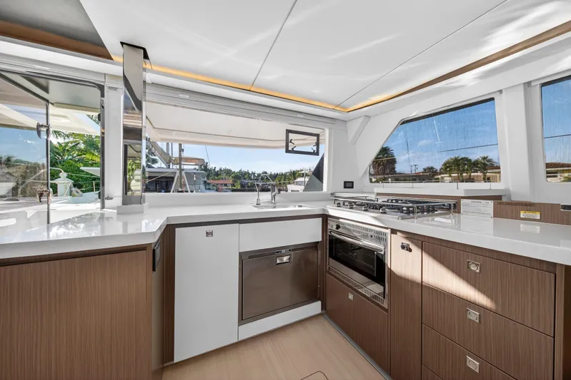  Yacht Photos Pics Modern kitchen interior of 2022 Leopard 45 yacht with sleek design and appliances.