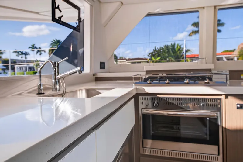  Yacht Photos Pics Modern kitchen interior on 2022 Leopard 45 yacht with sleek countertops and appliances.