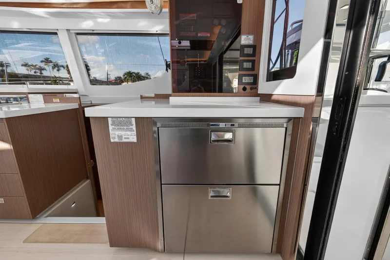  Yacht Photos Pics Modern kitchen area on a 2022 Leopard 45 yacht with stainless steel appliances.
