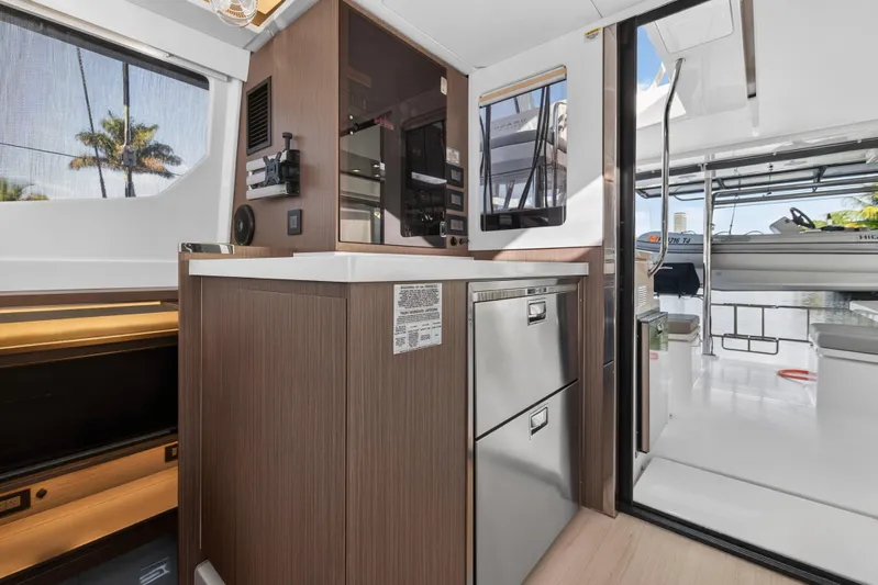  Yacht Photos Pics Modern kitchen interior on 2022 Leopard 45 yacht with sleek cabinetry and appliances.