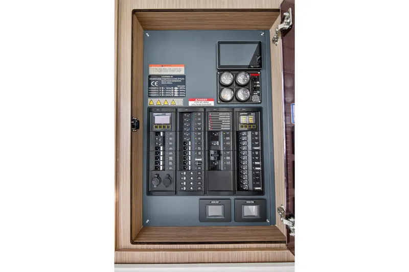  Yacht Photos Pics Electrical panel inside 2022 Leopard 45 model, featuring circuit breakers and gauges.