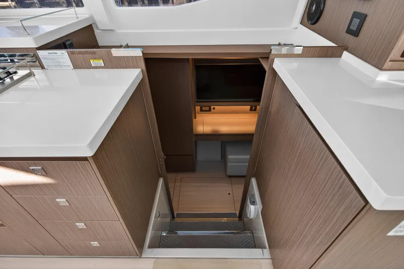  Yacht Photos Pics Interior view of 2022 Leopard 45 yacht, featuring modern wood cabinetry and sleek countertops.