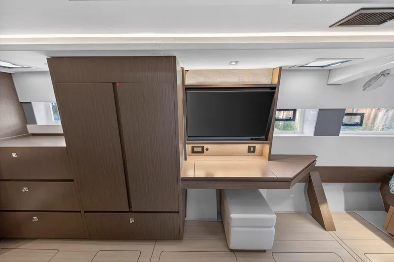  Yacht Photos Pics Luxurious interior of 2022 Leopard 45 yacht featuring modern cabinetry and a sleek workspace.