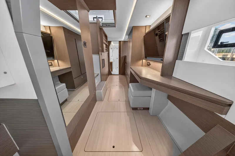  Yacht Photos Pics Luxurious interior of 2022 Leopard 45 catamaran with modern wood finishes and ample natural light.