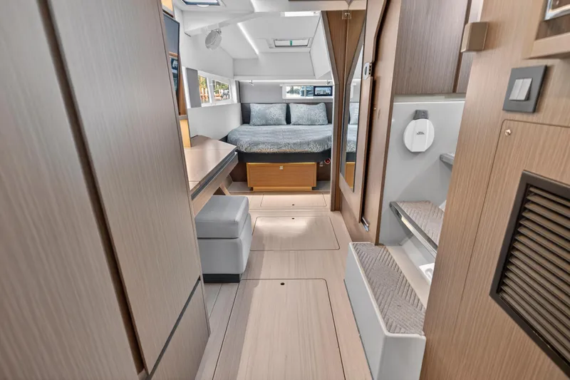  Yacht Photos Pics Luxurious interior of 2022 Leopard 45 catamaran featuring modern design and comfortable sleeping area.