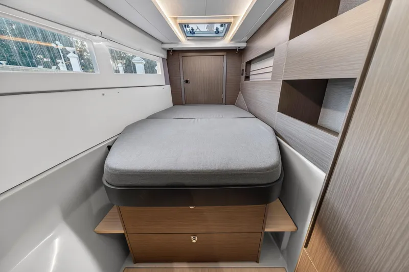  Yacht Photos Pics Modern interior of 2022 Leopard 45 yacht cabin with sleek design and comfortable bed.