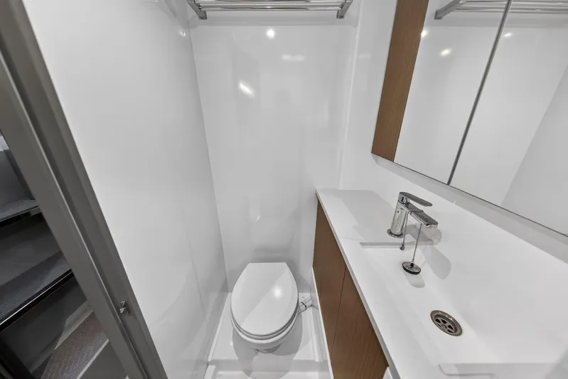  Yacht Photos Pics Modern bathroom in 2022 Leopard 45 yacht with sleek fixtures and compact design.