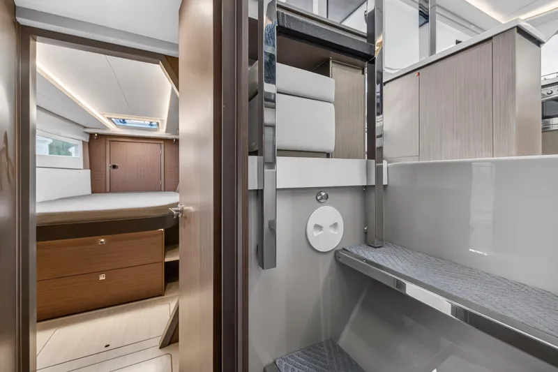  Yacht Photos Pics Luxurious interior of 2022 Leopard 45 yacht, featuring modern bedroom and sleek bathroom design.