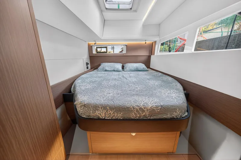  Yacht Photos Pics Luxurious bedroom interior of 2022 Leopard 45 yacht with modern design and natural light.