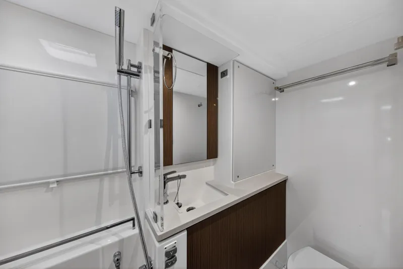  Yacht Photos Pics Modern bathroom in 2022 Leopard 45 yacht with sleek fixtures and minimalist design.