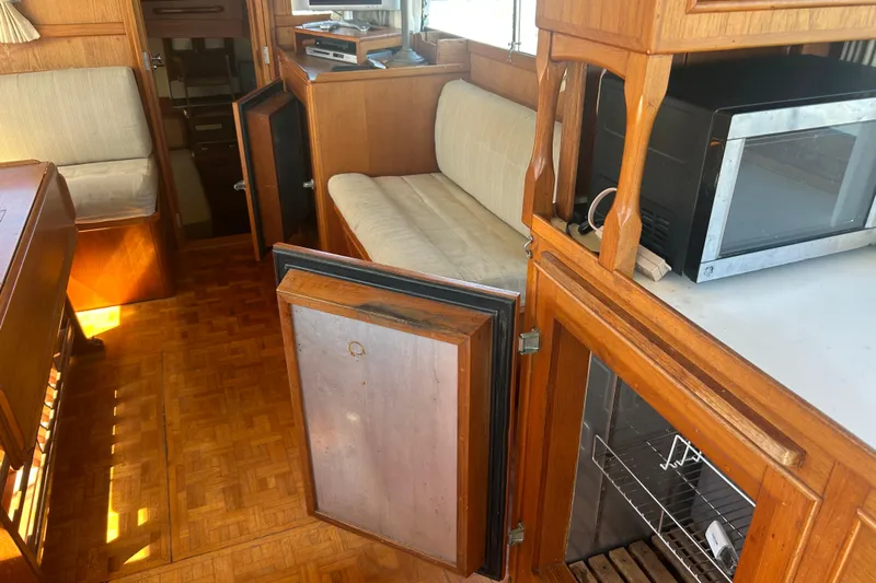 Metagene Yacht Photos Pics Interior of 1988 Grand Banks 42 Classic yacht with wood cabinetry and seating.