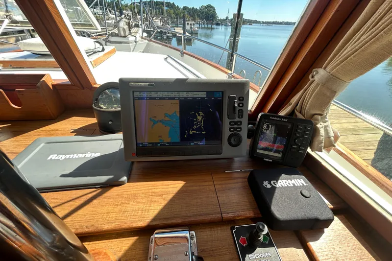 Metagene Yacht Photos Pics Grand Banks 42 Classic 1988 helm with Raymarine and Garmin navigation systems.