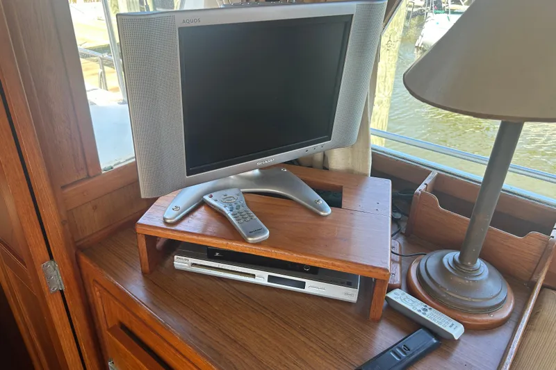Metagene Yacht Photos Pics Television setup on 1988 Grand Banks 42 Classic yacht with remote controls and lamp.