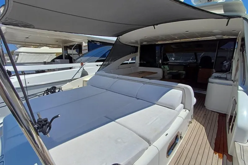  Yacht Photos Pics Luxurious 2010 Princess V62 yacht with spacious deck and comfortable seating area.