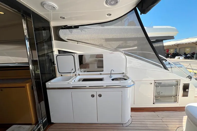  Yacht Photos Pics Outdoor kitchen on a 2010 Princess V62 yacht with sink and grill.