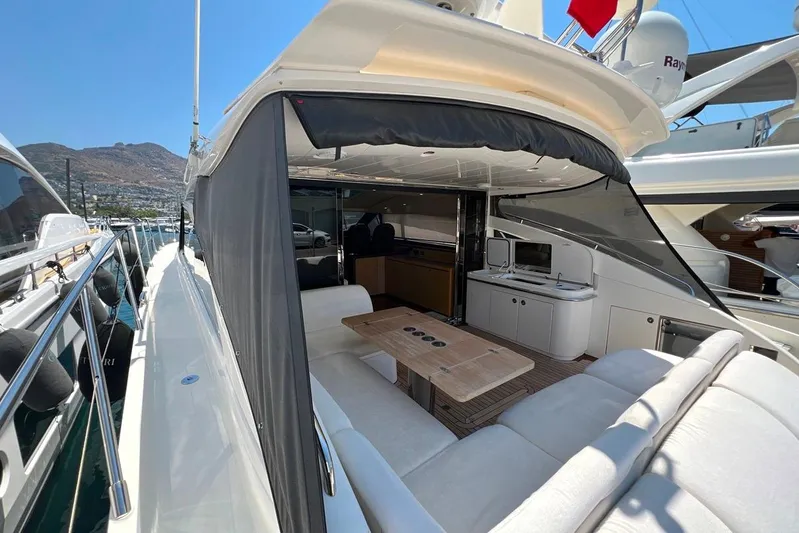  Yacht Photos Pics Luxurious 2010 Princess V62 yacht with spacious outdoor seating and modern amenities.