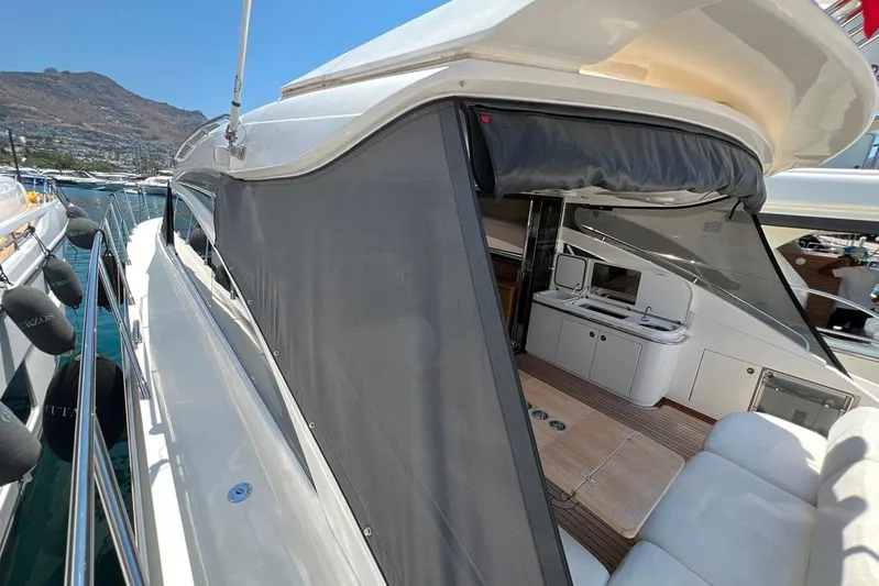  Yacht Photos Pics Luxury 2010 Princess V62 yacht with sleek design and spacious deck area.