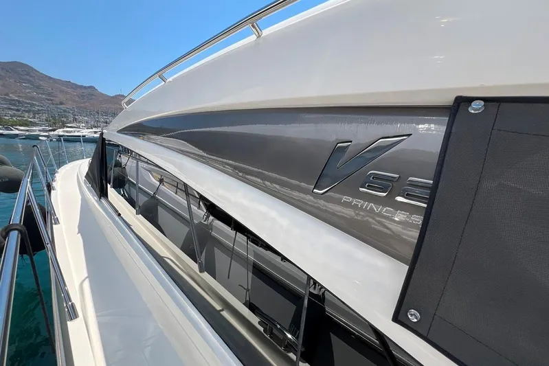  Yacht Photos Pics 2010 Princess V62 yacht docked in a marina, showcasing sleek design and luxury features.