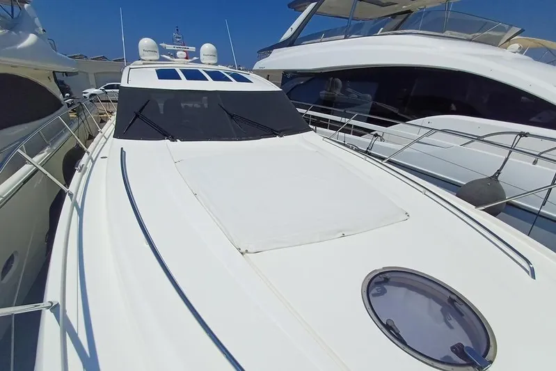  Yacht Photos Pics 2010 Princess V62 yacht docked, showcasing sleek design and modern features.