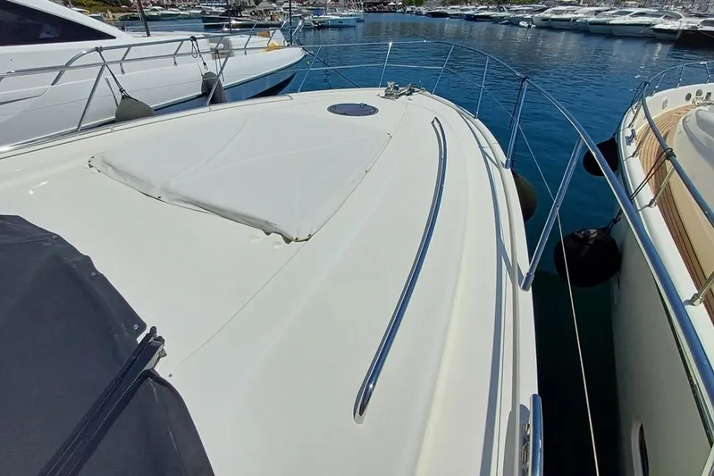  Yacht Photos Pics 2010 Princess V62 yacht docked at marina, showcasing sleek deck design.