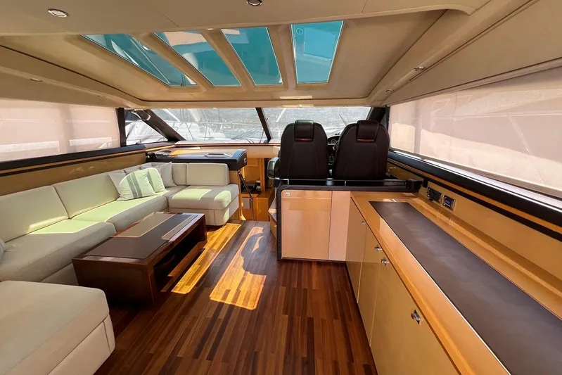  Yacht Photos Pics Luxurious interior of 2010 Princess V62 yacht with elegant seating and wooden flooring.