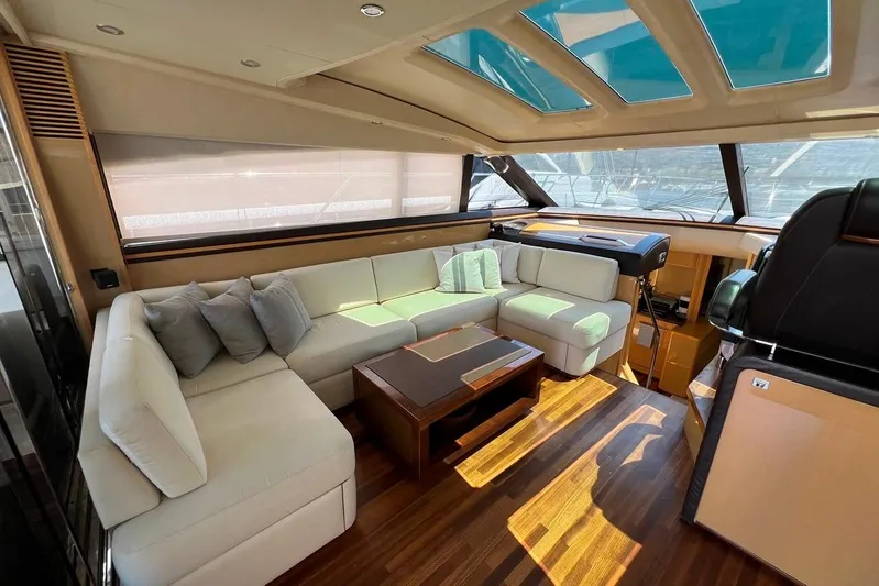  Yacht Photos Pics Luxurious interior of 2010 Princess V62 yacht with elegant seating and wooden flooring.
