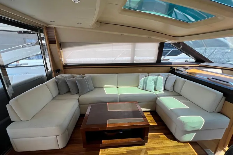  Yacht Photos Pics Luxurious interior of 2010 Princess V62 yacht with elegant seating and wooden table.