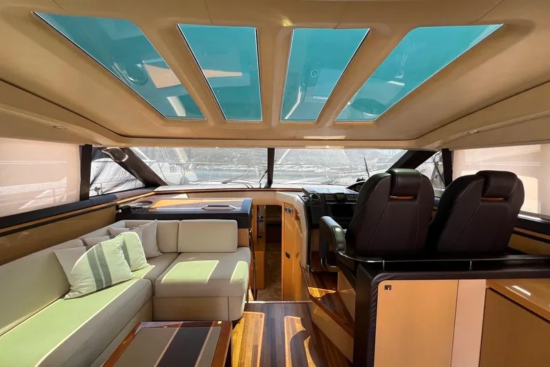  Yacht Photos Pics Luxurious interior of 2010 Princess V62 yacht with skylights and elegant seating.